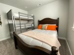 Summer room on lower level - queen bed and triple bunk bed